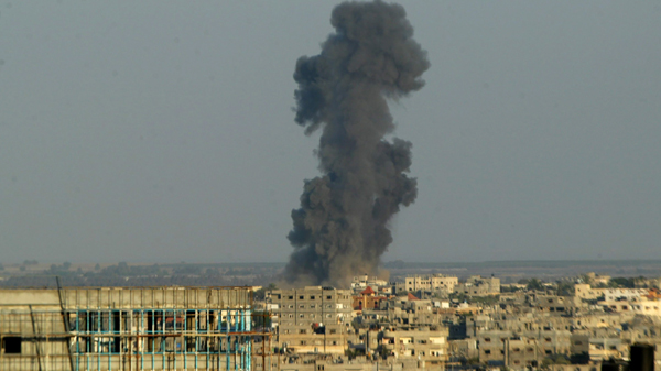 Smoke is seen after what witnesses said was an Israeli air strike in the southern Gaza strip in 2014