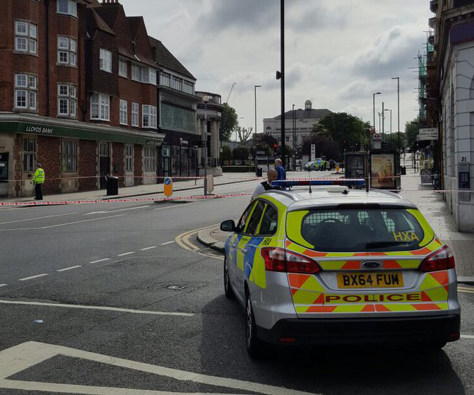 A police car stationed on Goders Green road after the area was cornered off