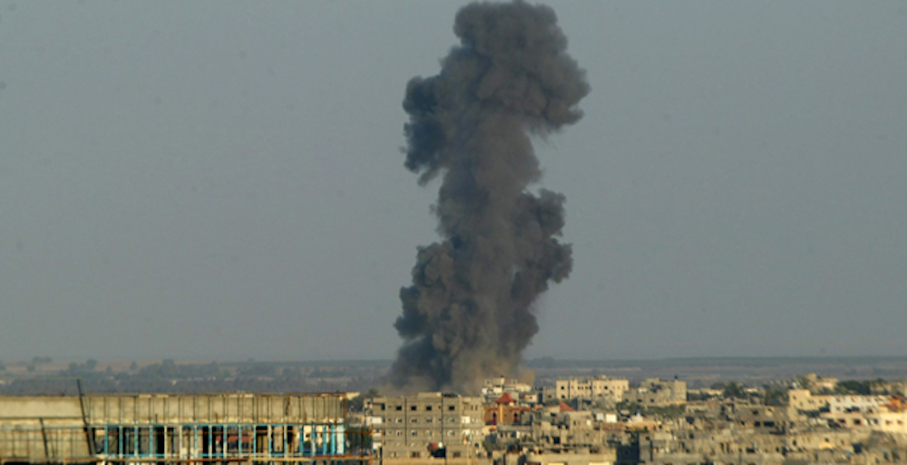 Smoke is seen after an Israeli air strike in Rafah in the southern Gaza strip, August 19, 2014. 