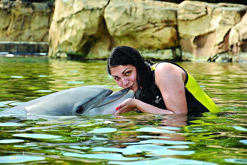 Sarah with Roxy the dolphin