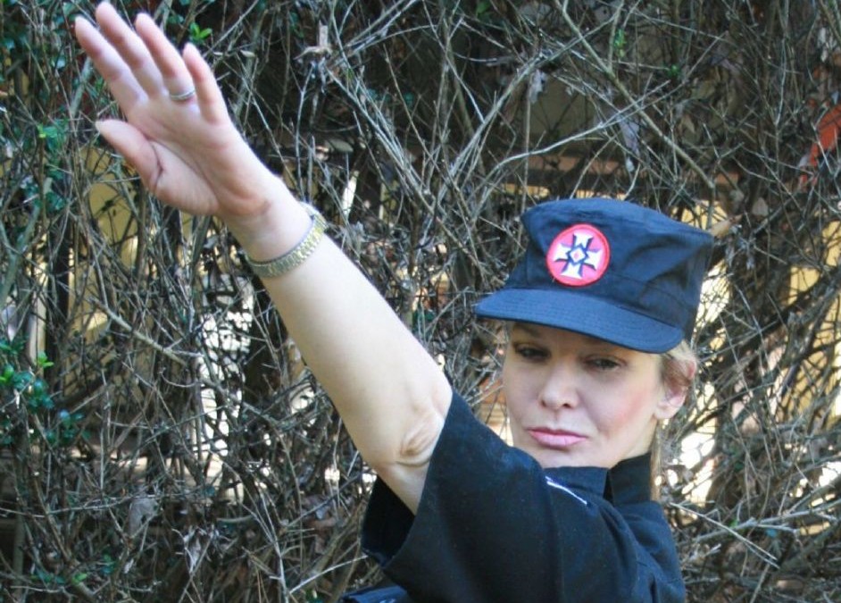A female KKK member doing a Hitler salute (Image provided by Hope Not Hate)