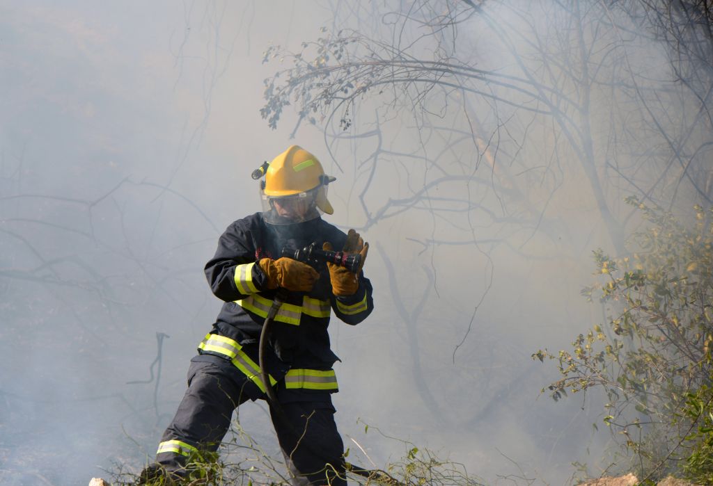 A fire fighter tackles the blaze 