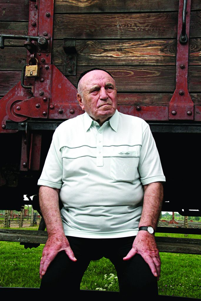 Leslie sits shiva for his family on the cattle car in Birkenau on the only spot he has identified as the last place he saw his mother and seven siblings