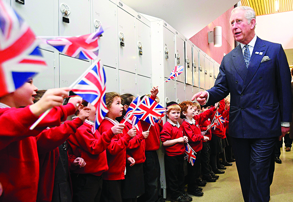 The Prince of Wales is greeted by pupils during his visit to Yavneh College, an Orthodox Jewish school in Borehamwood, Hertfordshire.
