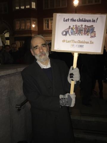 Rabbi Jonathan Wittenberg pictured with placard