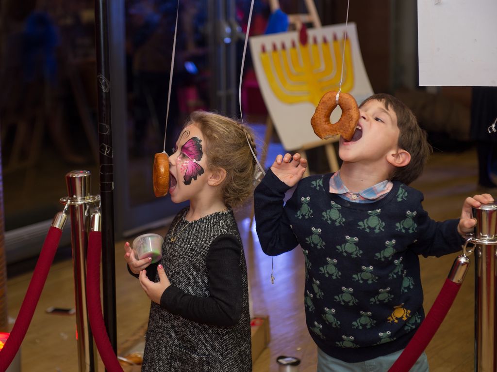Children enjoy doughnuts at Chabad Belgravia