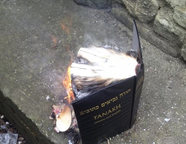 The image Shneur Odze tweeted, of him burning the book (Via The Daily Mail)