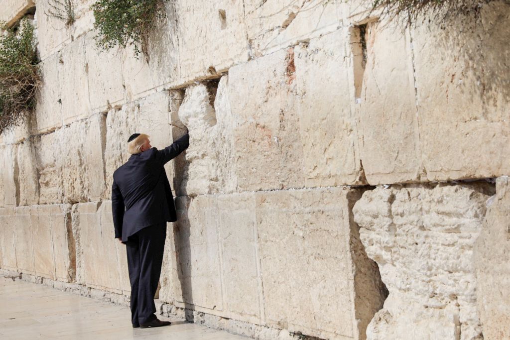 U.S. President Donald Trump places a note in the stones of the Western Wall, Judaism's holiest prayer site, in Jerusalem's Old City May 22, 2017. Photo by: Nati Shochat-JINIPIX 