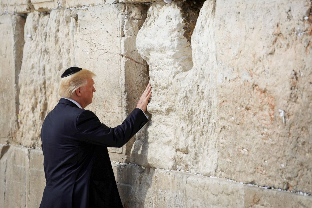 U.S. President Donald Trump places a note in the stones of the Western Wall, Judaism's holiest prayer site, in Jerusalem's Old City  Photo by: Nati Shochat-JINIPIX 