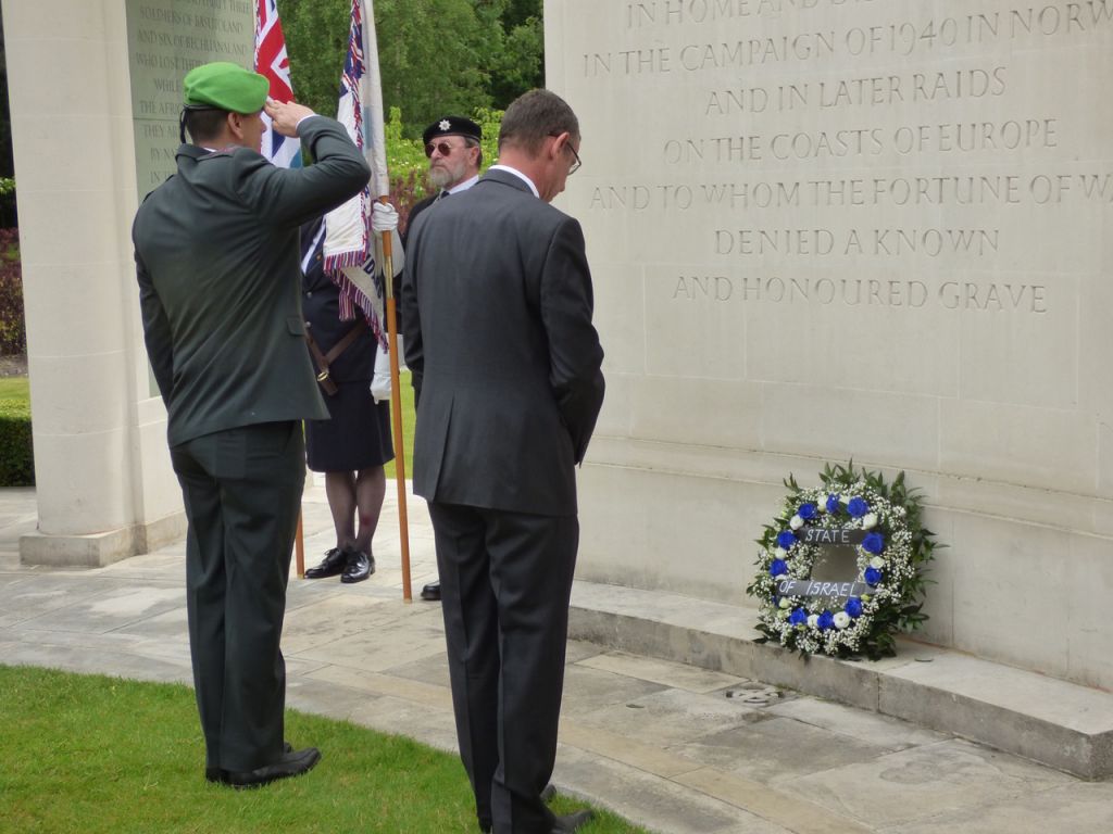 Mark Regev paying his respects to the men who perished 