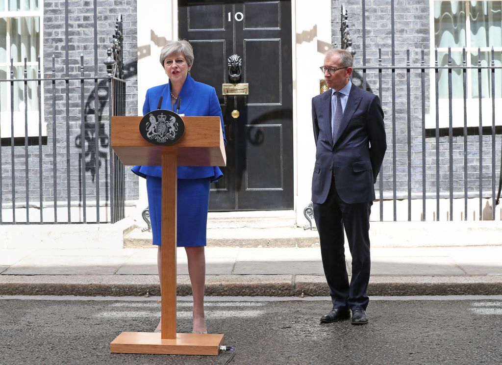 Prime Minister Theresa May, accompanied by her husband Philip, making a statement in Downing Street after she traveled to Buckingham Palace for an audience with Her Majesty the Queen following the General Election results. Photo credit: Jonathan Brady/PA Wire 