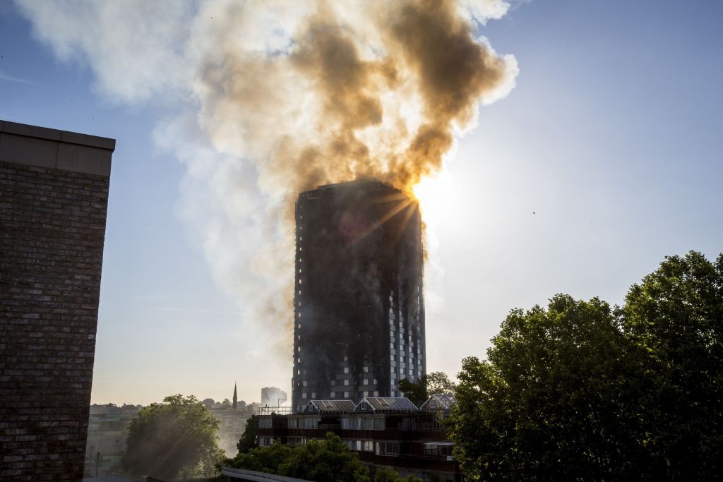 Smoke billows from a fire that has engulfed the 27-storey Grenfell Tower in west London.  Photo credit: Rick Findler/PA Wire 