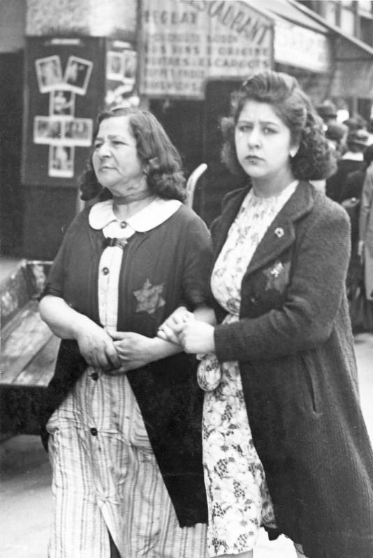 Women in Paris with a yellow star on their clothes marking them out as Jews