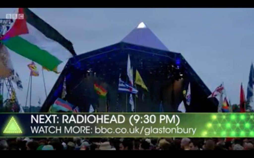 A Palestinian flag flutters as Radiohead take to the stage 