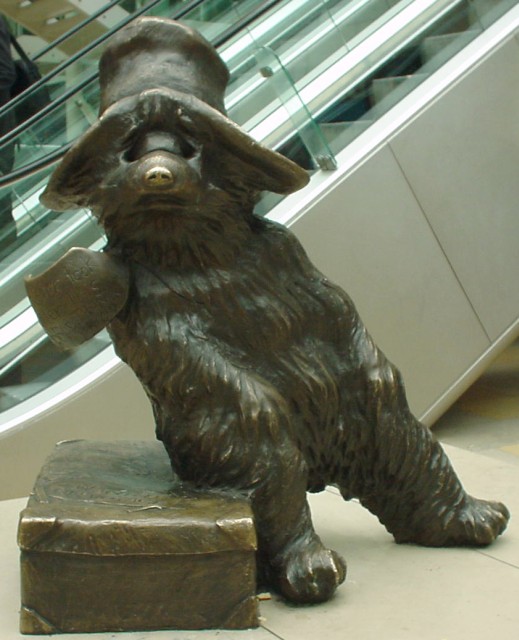 Life-size bronze statue of Paddington Bear, the fictional bear created by Michael Bond, at Paddington station 