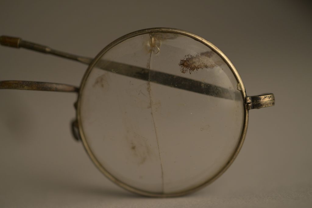 Glasses from an unknown deportee to Auschwitz, collection from the Auschwitz-Birkenau State Museum. Photo by Pawel Sawicki © Auschwitz-Birkenau State Museum - Musealia