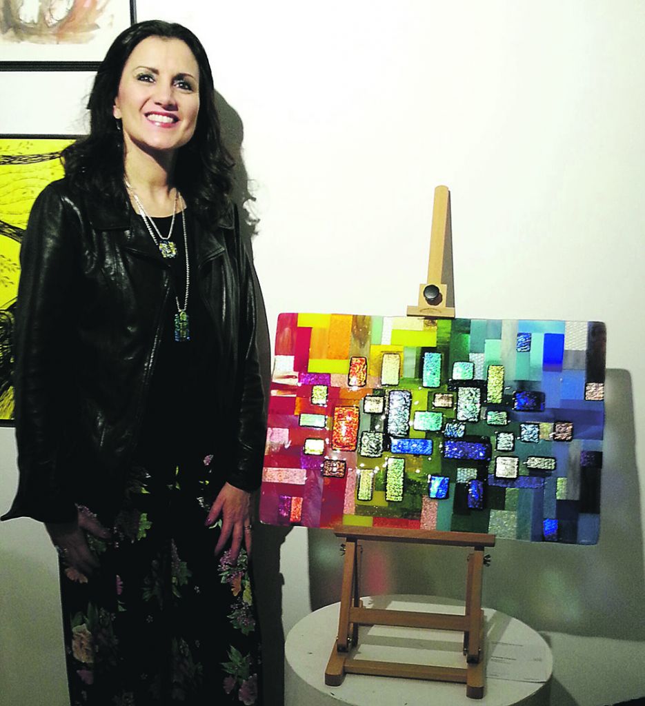 Artist Amanda Charles with her work, entitled My Happy Place 
