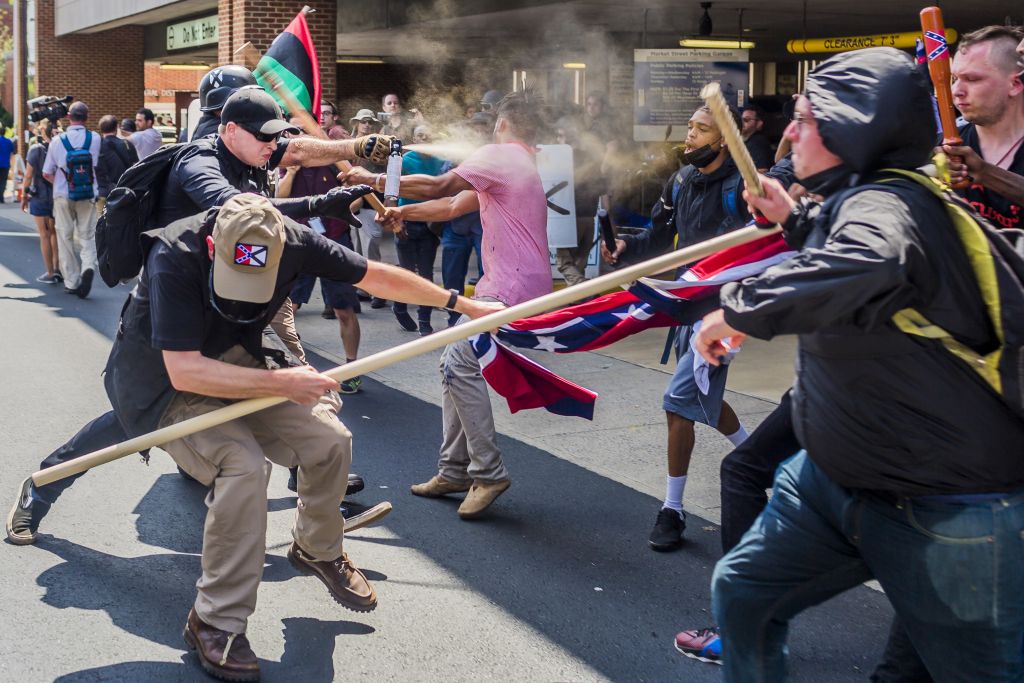 Far-right protestors and anti-fascist demonstrators clash in Charlottesville, Virginia.  