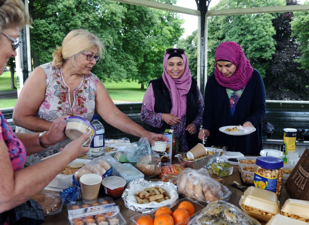Jewish and Muslim women get stuck into the picnic, as they forge new friendships (photo credit: Yorkshire Evening Post)