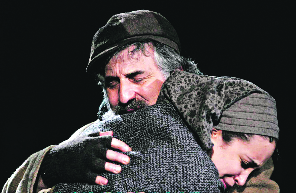 Alexandra, as Hodel, embraces her father Tevye, played by Henry Goodman