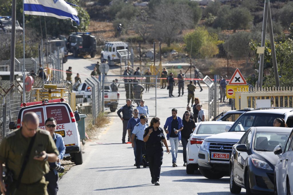 Israeli security deploys at an entrance to Har Adar settlement near Jerusalem, after a Palestinian assailant opened fire killing three Israeli men and critically wounding a fourth. (AP Photo/Mahmoud Illean) 
