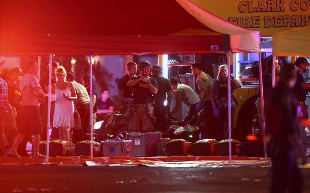 Medics treat the wounded as Las Vegas police respond during an active shooter situation on the Las Vegas Stirp in Las Vegas (Chase Stevens/Las Vegas Review-Journal via AP) 