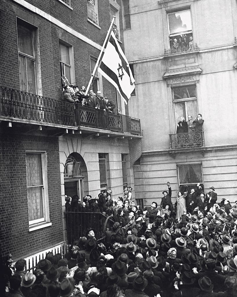 The flag of the Israeli Government, proclaiming the recognition of the government by Britain, was hoisted at the offices of the Israeli Government in Manchester Square, London 