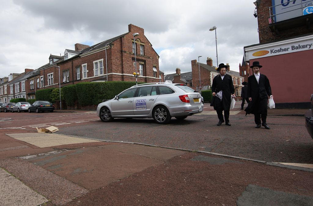 Orthodox Jewish teens crossing the road in Gateshead 