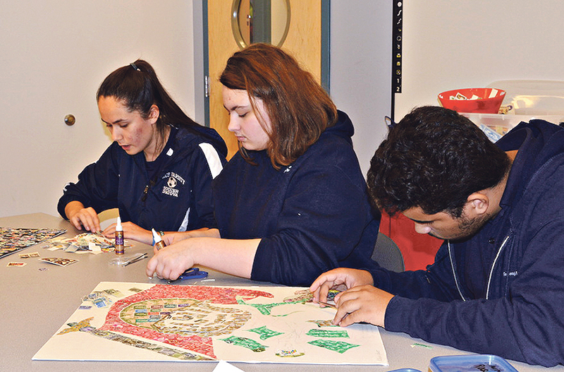 Students creating one of the artworks