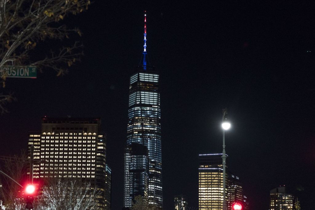 As ordered by New York Gov. Andrew Cuomo, the spire of One World Trade Center is illuminated in red, white and blue following a deadly rampage down a bike path not far from the building (AP Photo/Craig Ruttle) 