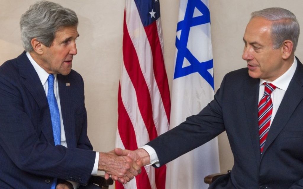 U.S. Secretary of State John Kerry, left, and Israeli Prime Minister Benjamin Netanyahu shake hands.