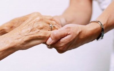 Elderly and young people lock hands