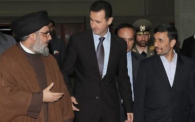 Hezbollah leader Hassan Nasrallah with Syrian President Bashar Al-Assad (centre) and former Iranian leader Mahmoud Ahmadinejad