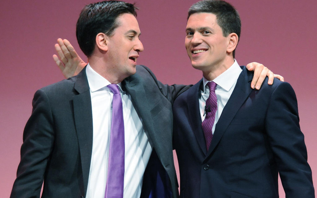 Ed Miliband (left) with his brother David, putting a brave face on strained relations in 2013