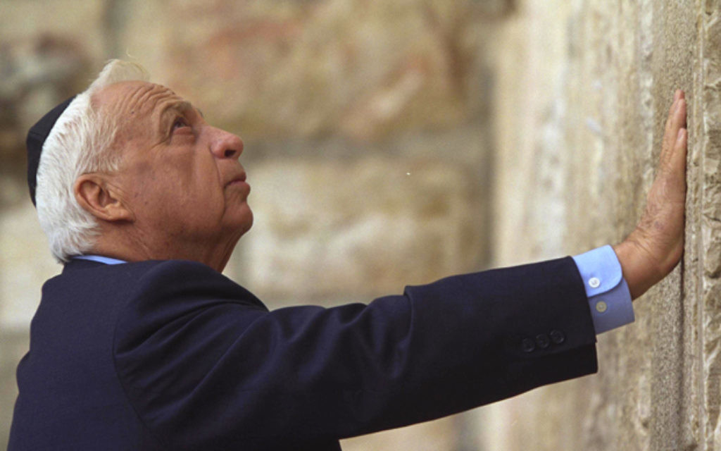 Ariel Sharon, pictured at the Western Wall, has been in a coma for eight years.