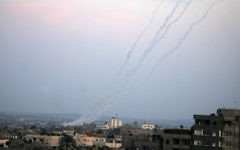 Smoke trails are seen after Hamas rockets are fired in the southern Gaza Strip towards southern Israel, in 2012. Smoke trails are seen after Hamas rockets are fired in the southern Gaza Strip towards southern Israel, in 2012.