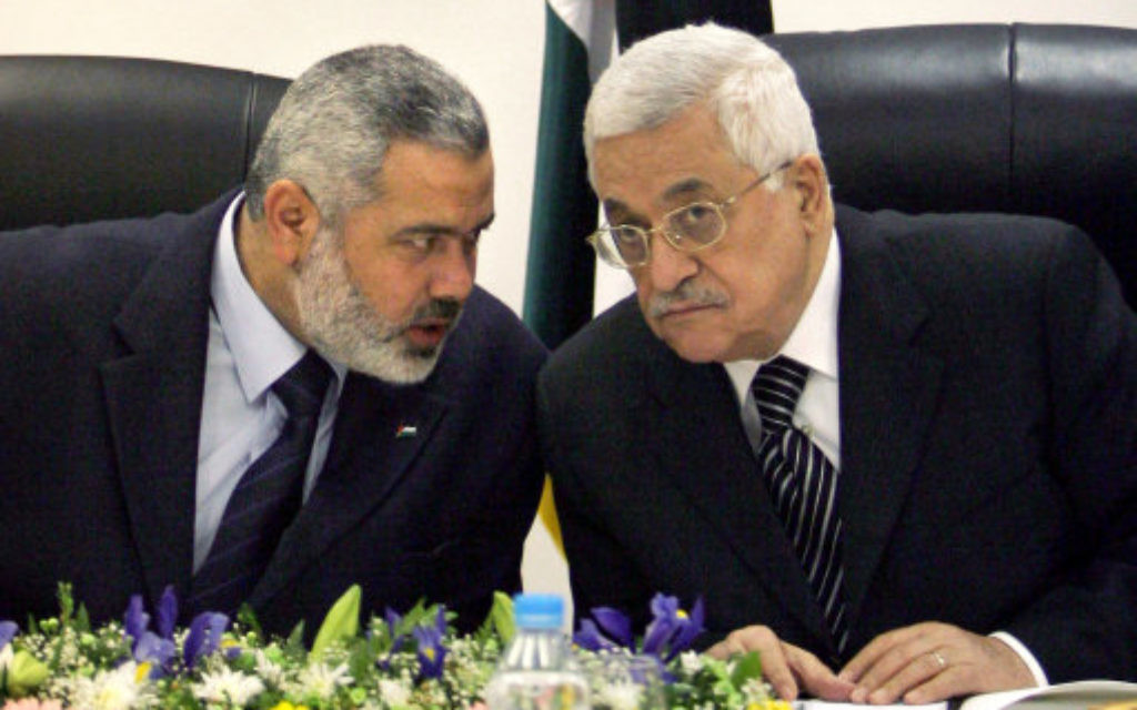 Palestinian Authority President Mahmoud Abbas, right, and Ismail Haniyeh, formerly of Hamas, left.