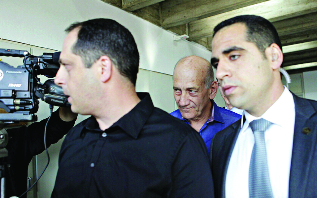 Olmert arrives to learn his fate.