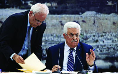 Palestinian Authority President Mahmoud Abbas  (right) with negotiator  Saeb Erekat (left)