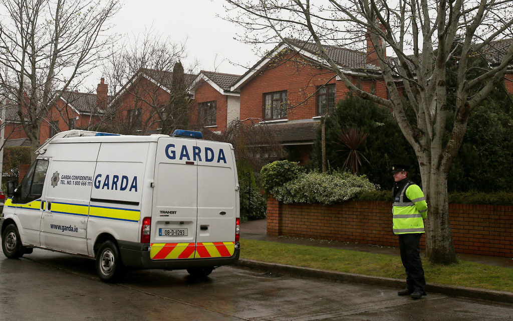 Members of An Garda outside the home of Ireland's Justice Minister Alan Shatter in Dublin.