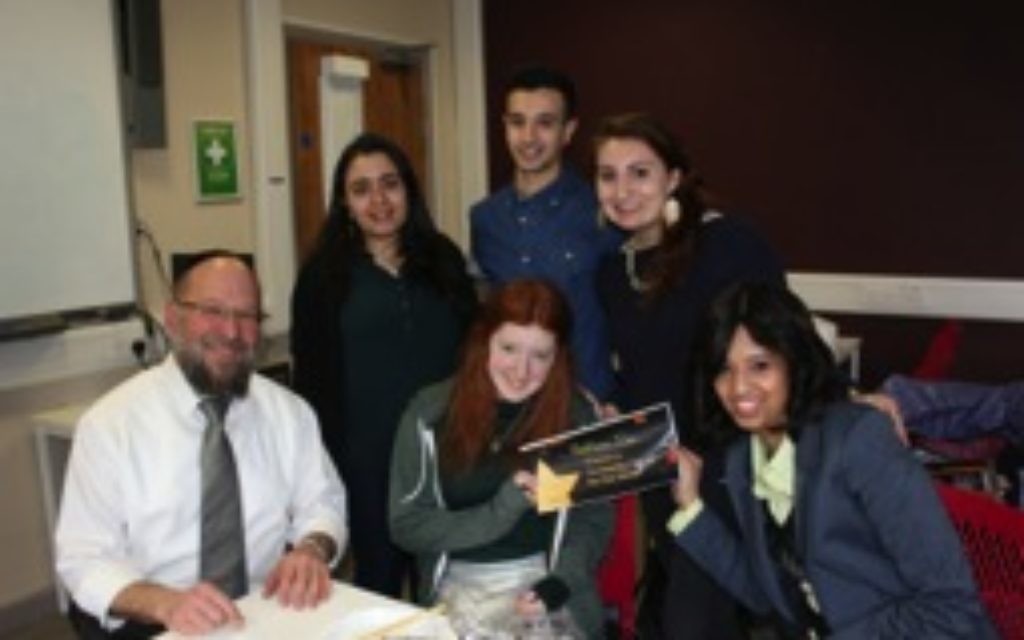 Students show off their UJS Student Awards certificate as they pose for a picture with Rabbi ‘Rav Gav’ Broder