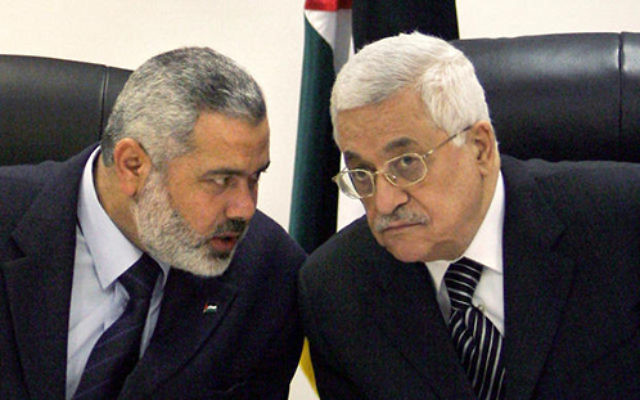 Palestinian Authority President Mahmoud Abbas, right, and Ismail Haniyeh of Hamas, left.