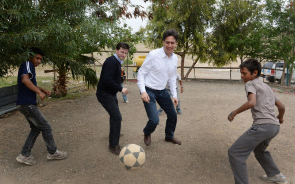 Labour leader Ed Miliband and Shadow Foreign Secretary Douglas Alexander (2nd left) play football during a visit to the Khan al-Ahmar Bedouin community in the West Bank.
