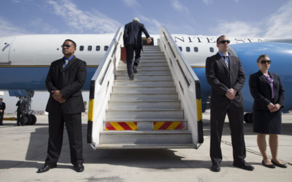 U.S. Secretary of State John Kerry climbs up the stairs of the plane to leave Tel Aviv, Israel Tuesday April 1, 2014, continuing on to NATO meetings in Brussels after meeting in Israel with Israeli Prime Minister Benjamin Netanyahu about the Middle East peace process talks. (AP Photo/Jacquelyn Martin, Pool)
