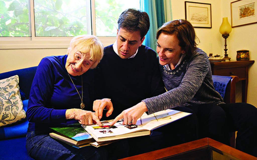 Miliband and his wife Justine were shown a photo album by his 84 year-old Aunt Sarah Ben Zvi at her home on Nachshonim Kibbutz. Photo: Stefan Rousseau/PA Wire