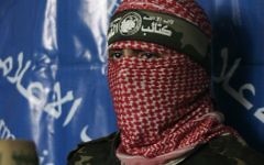 A masked Hamas spokesman