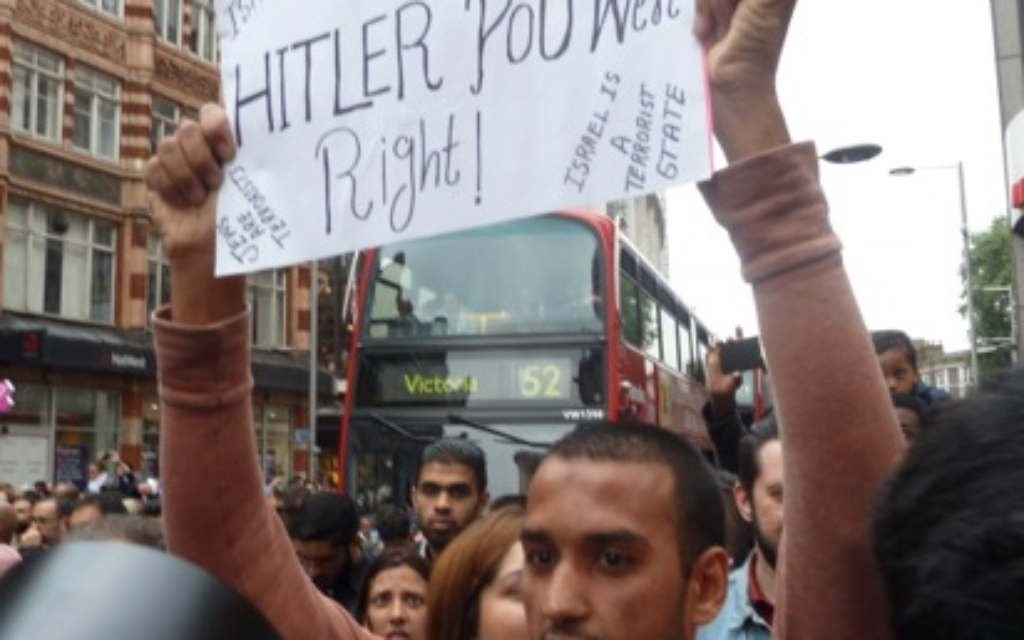Hussain Yousef holding his anti-Semitic sign in London, 2014