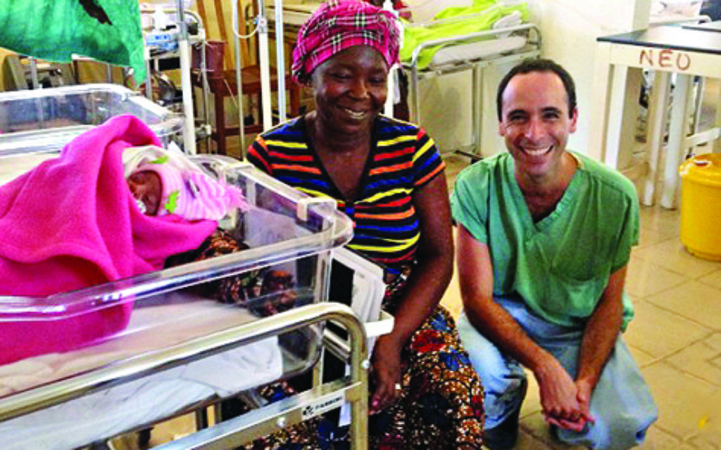Dr Black with a patient at his maternity clinic in southern Sierra Leone