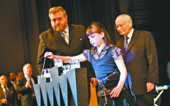 Holocaust survivor Alfred Huberman and his granddaughter Faye Huberman Holocaust memorial day 2009.