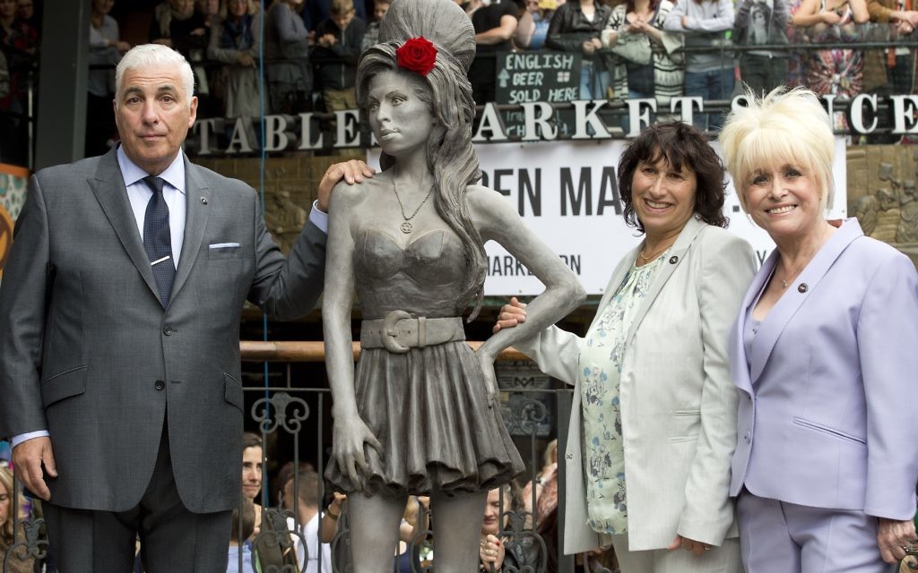 Amy Winehouse's parents Mitchell and Janis pose with Barbara Windsor after Winehouse's statue was unveiled at the Stables Market, Camden Town.